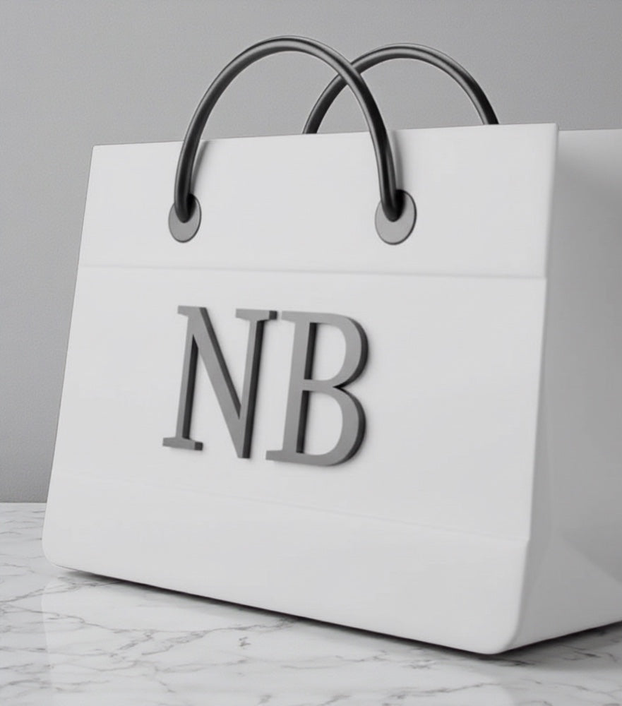 White shopping bag with black handles and 'NB' initials on a gray background